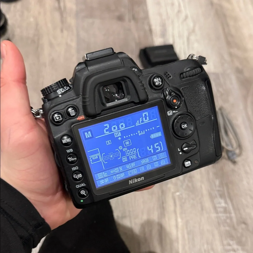 Nikon DSLR D7000 Camera with Black Battery Grip and Accessories